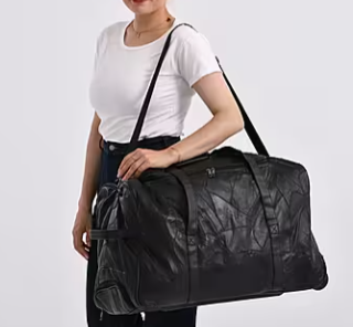 Black Patchwork Sheepskin Wheeled Travel Bag